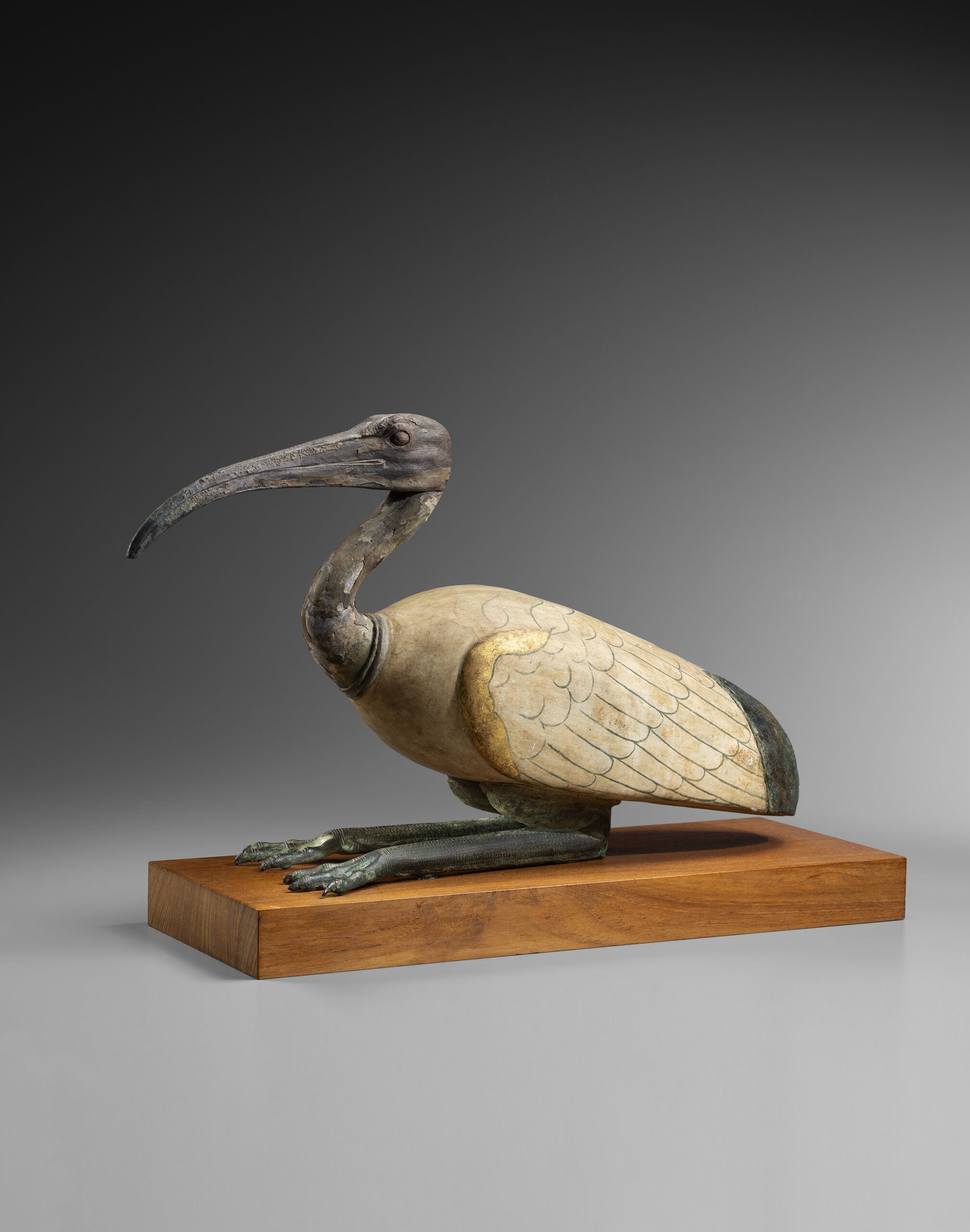 AN EGYPTIAN WOOD AND BRONZE IBIS